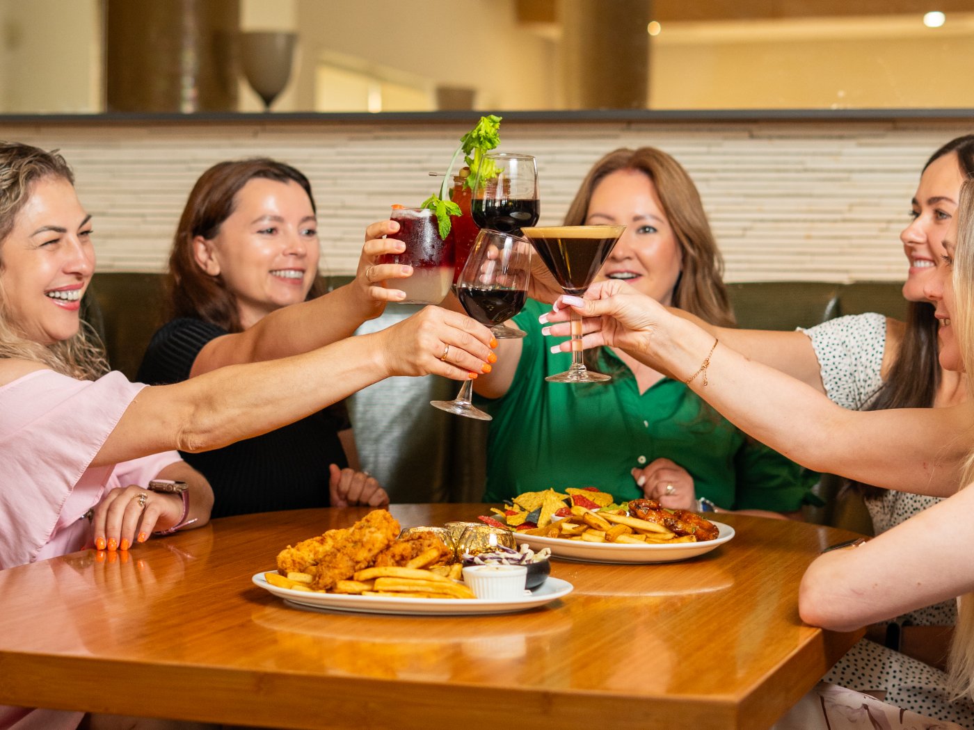 Friends sharing drinks in the dining room